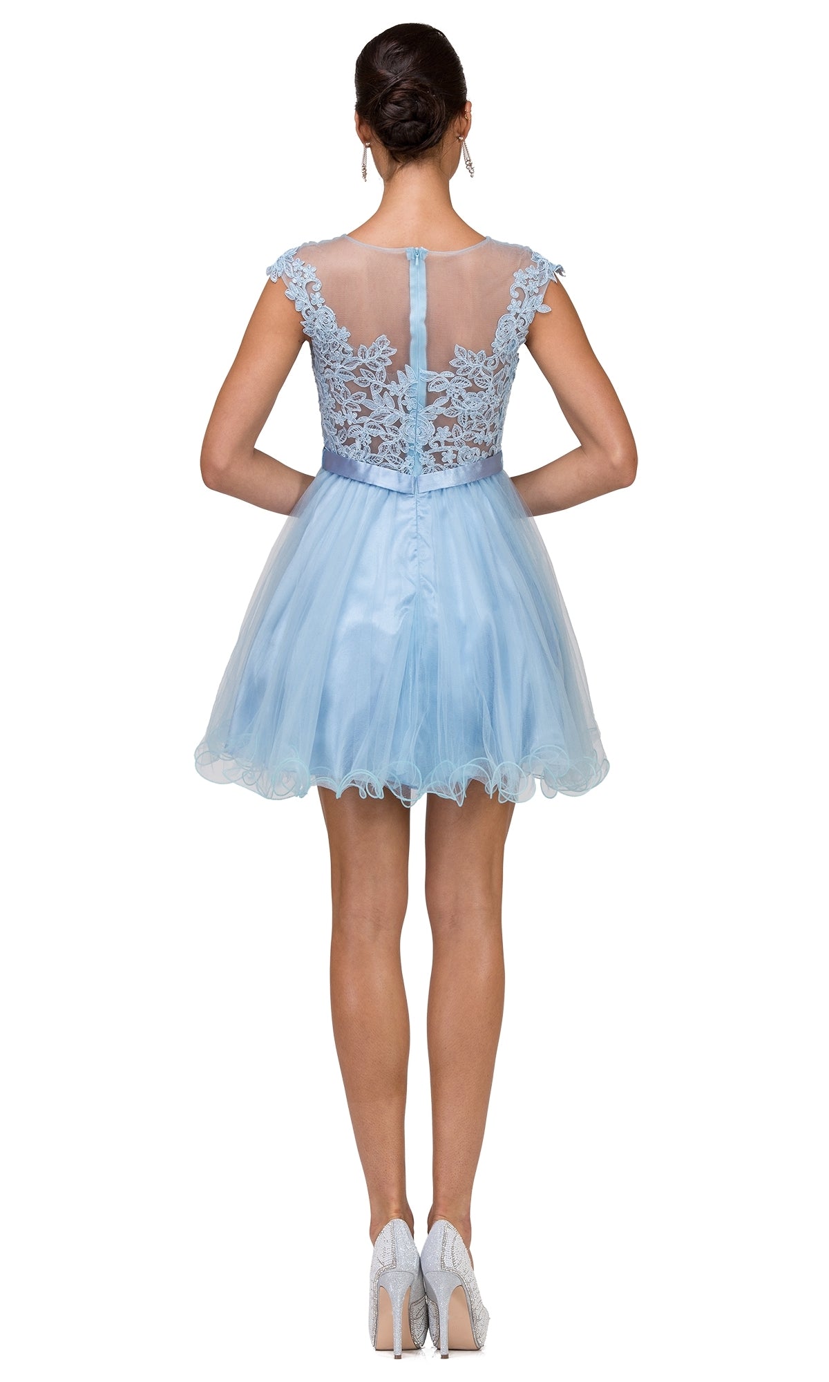 A woman in the Lace-Applique-Bodice Short Homecoming Dress, featuring light blue embroidered lace and a sheer back, stands facing away in silver high heels.